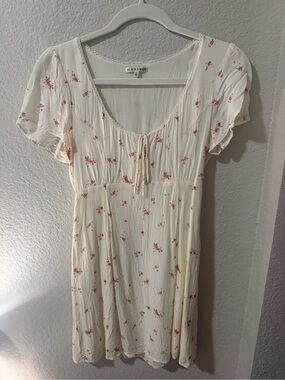 Black Swan Cream Dress with Subtle Pink Floral Accents